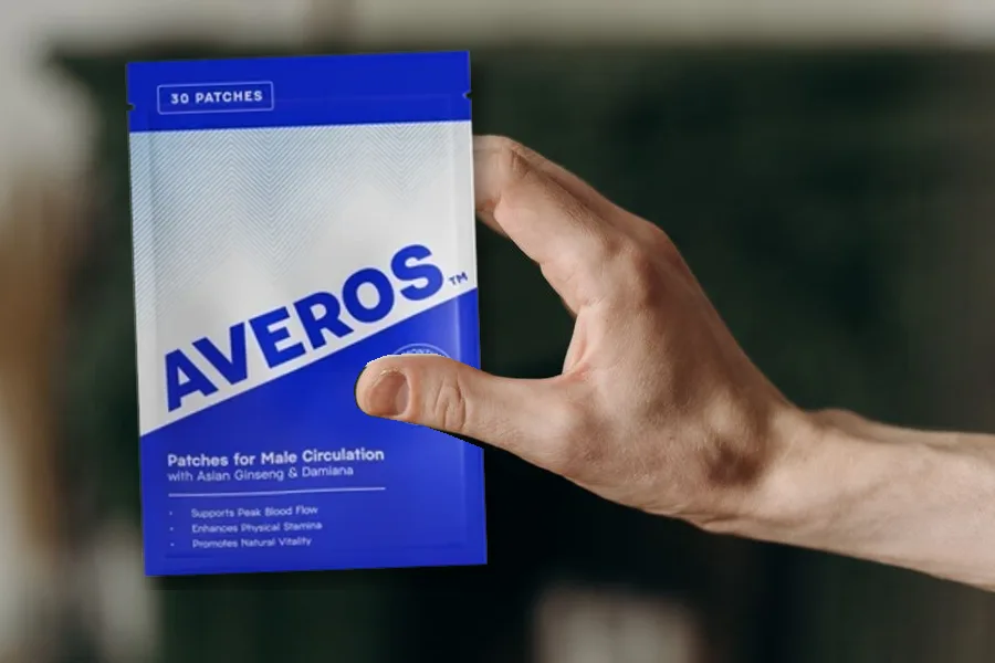Man's hand holding a pack of Averos patches for male circulation